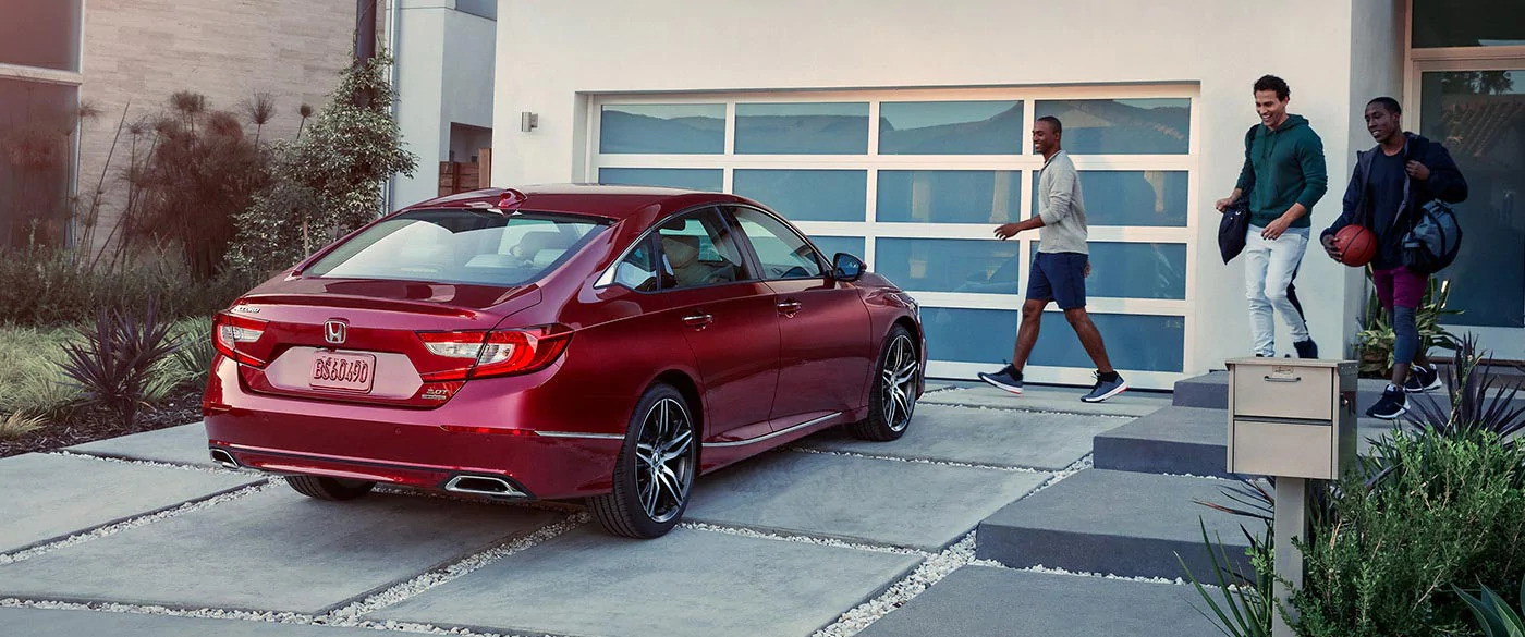 Red Honda Accord outside of house
