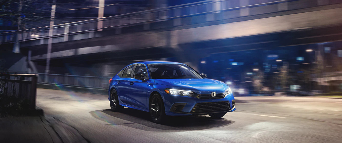 Blue Honda Civic Sedan on the road